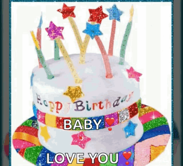 a birthday cake with candles and stars on it and the words happy birthday baby love you