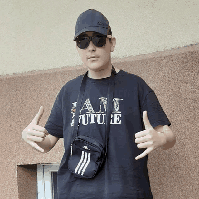 a man wearing a black shirt that says " i am the future "