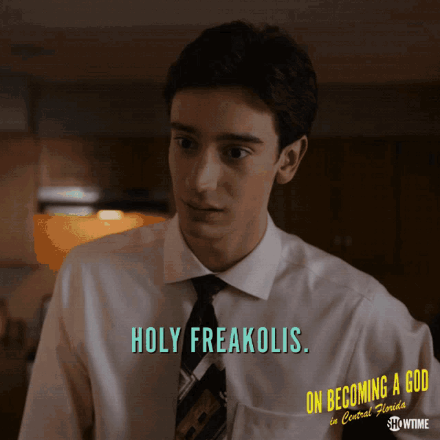 a man wearing a shirt that says holy freakolis