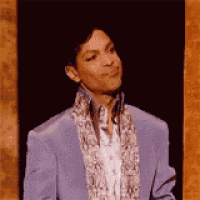 prince is wearing a purple jacket and a scarf around his neck