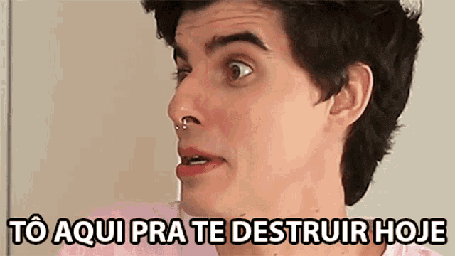 a man with a nose ring has the words to aqui pra te destruir hoje below his face