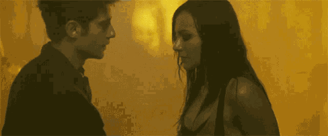 a man and woman are looking into each other 's eyes