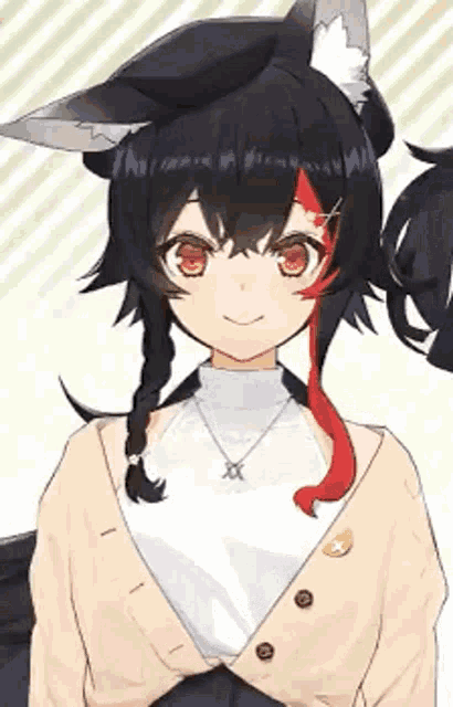 a girl with fox ears is wearing a sweater and a necklace and smiling .