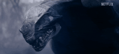 a close up of a monster 's head with a netflix logo in the background .