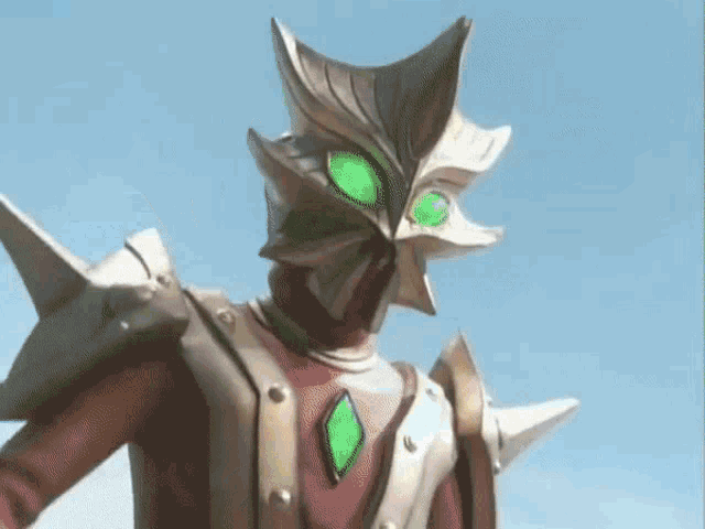 a cartoon character has green eyes and a shield on his chest