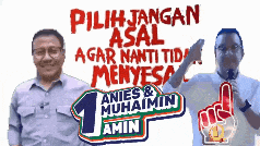 two men are standing next to each other in front of a sign that says pilih jangan asal agar nanti tidak menyesal