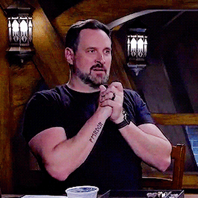 a man with a tattoo on his arm that says ' patrick '