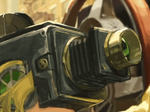 a close up of a camera with a green lens