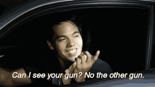 a man in a car is asking if he can see his gun