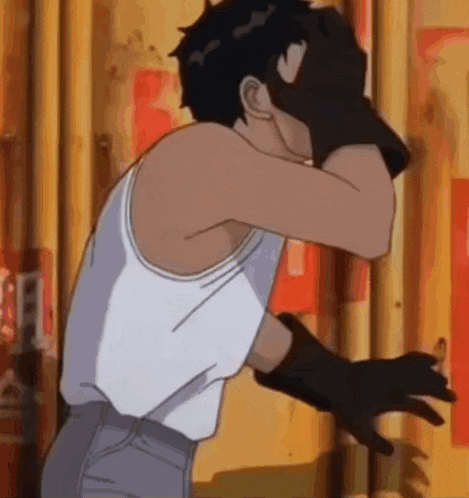 a man in a white tank top is covering his face with his hands .