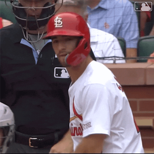 a baseball player wearing a red helmet with the letter c on it