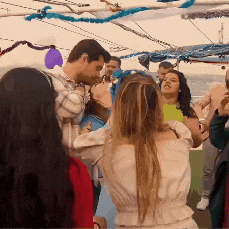 a group of people are dancing on a boat with balloons and decorations