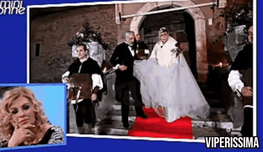 a bride and groom are walking down stairs on a red carpet with the words viperissima below them