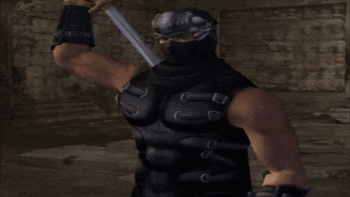 a man in a ninja costume is standing in a dark room