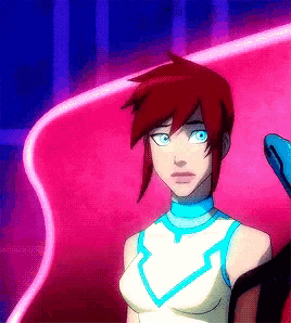 a girl with red hair and blue eyes is standing in front of a pink background