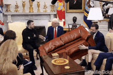 a group of people are sitting around a table with a couch on it and the word paulley ticks written on the bottom