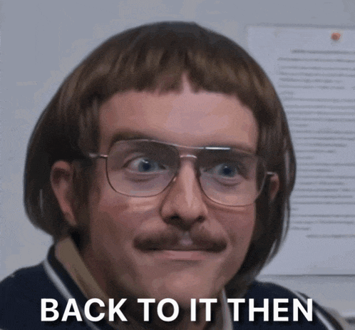 a man with glasses and a moustache has the words back to it then written on his face