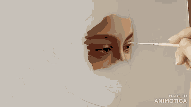 a person is painting a woman 's face with a brush and the words made in animatica on the bottom right