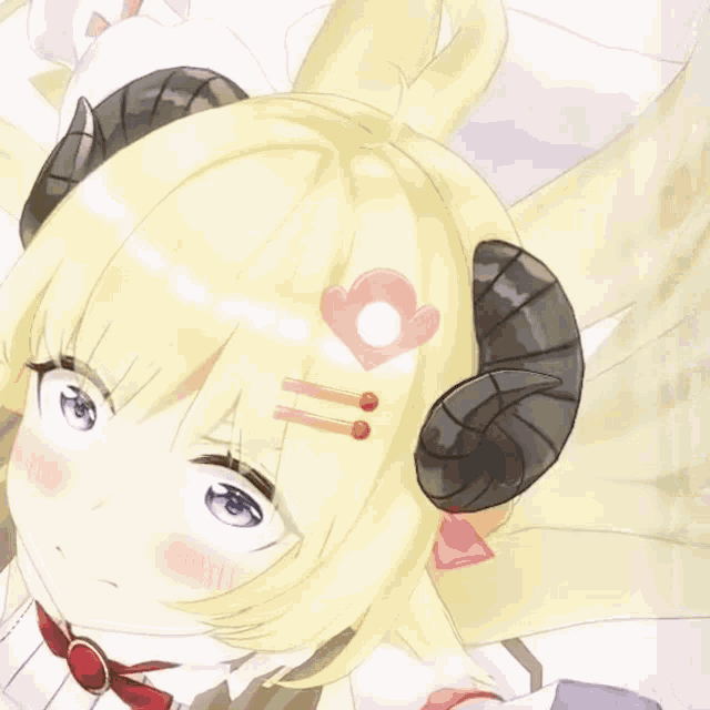 a close up of a girl with horns and a heart on her hair
