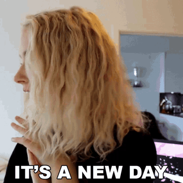 a woman says it 's a new day with her hair