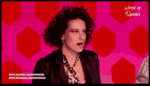 a woman with curly hair is on a screen with the words world of queens