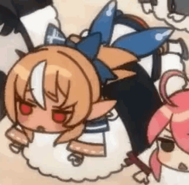 a group of anime characters are laying on top of each other on the ground .