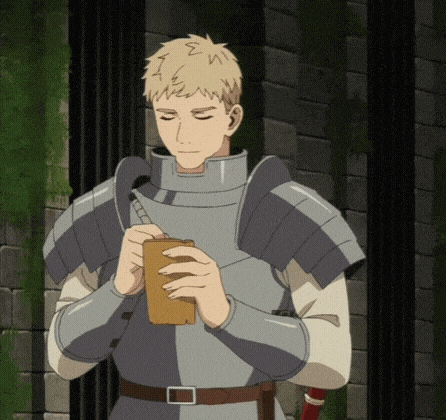 a man in armor is holding a book and smiling