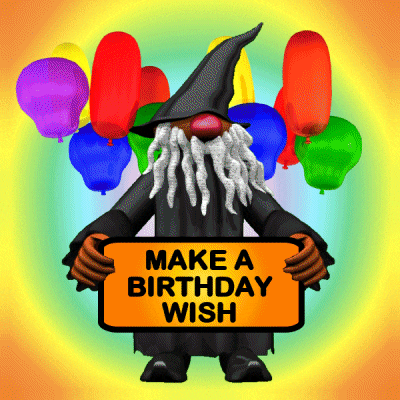a gnome holding a sign that says " make a birthday wish "