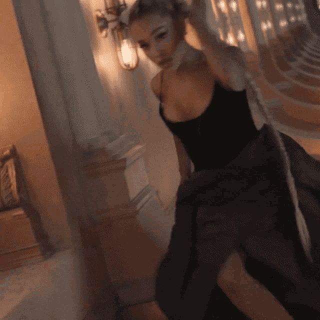 a blurry picture of a woman in a black top
