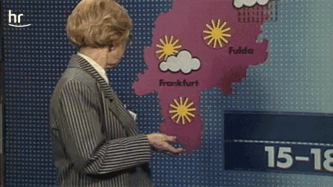 a woman is standing in front of a map that says frankfurt on it