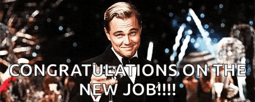 a man in a suit and tie is congratulating someone on their new job