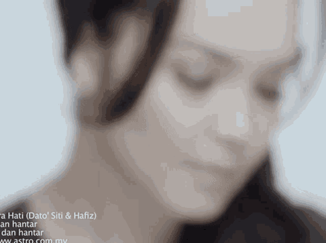 a close up of a woman 's face with the website astro.com.my in the bottom right corner