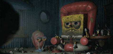 a spongebob sitting in a chair with a life preserver in his hand