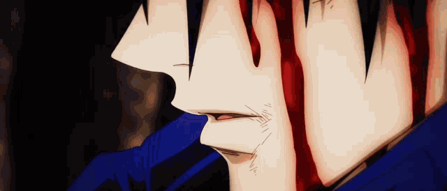 a close up of a man 's face with blood coming out of his mouth