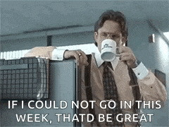 a man in a suit and tie is drinking a cup of coffee from a mug .