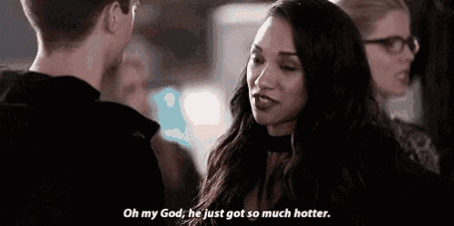 a woman is talking to a man in a room and says `` oh my god , he just got so much hotter '' .