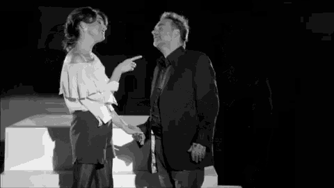 a black and white photo of a man and a woman
