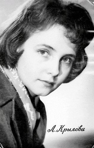 a black and white photo of a young woman with the name a. krilova written on the bottom