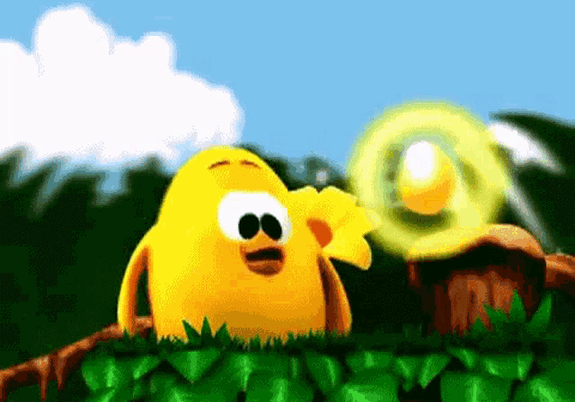 a yellow cartoon character is standing in the grass with a flower in its mouth .