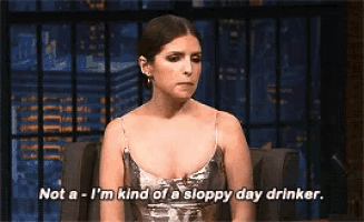 a woman in a silver dress says not a - i 'm kind of a sloppy day drinker .
