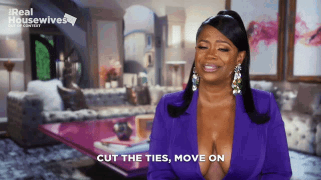 a woman says cut the ties move on while wearing a purple suit