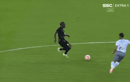 two soccer players on a field with ssc extra 1 written on the bottom