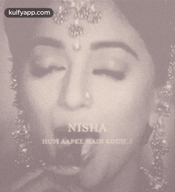 a close up of a woman 's face with the name nisha written on it