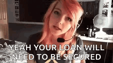 a girl with pink hair is wearing a headset and says `` yeah your loan will need to be secured `` .
