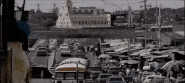 a black and white photo of a busy city street with a sign that says acer