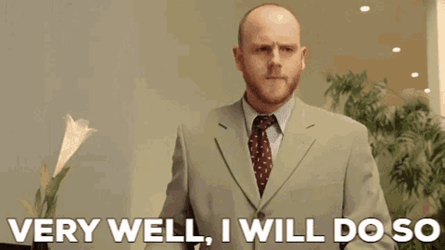 a man in a suit says very well i will do so