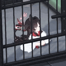 a girl is behind bars in a cage with a cat
