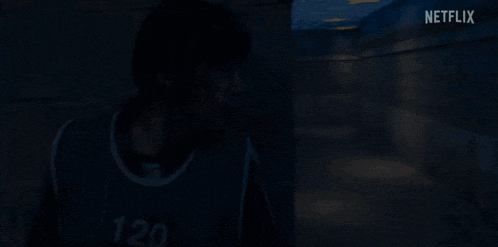 a netflix logo can be seen in the background of a blurry picture