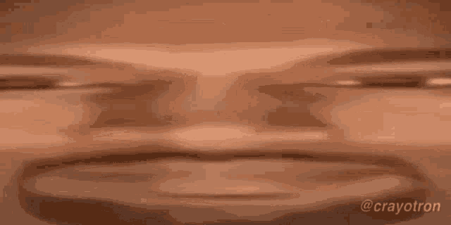 a close up of a person 's face with their eyes closed and a blurry background .