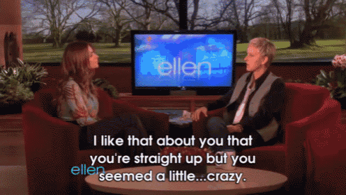 two women are sitting in front of a television that says ellen on it